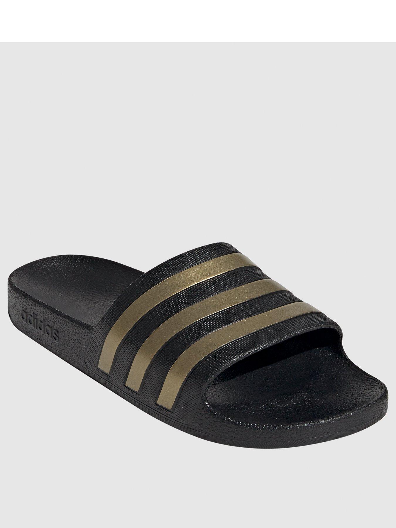 Adidas black best sale and gold sliders