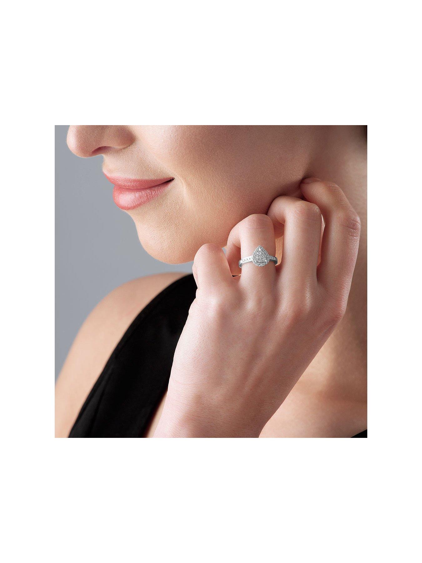 beaverbrooks-platinum-diamond-pear-shaped-cluster-halo-ringoutfit