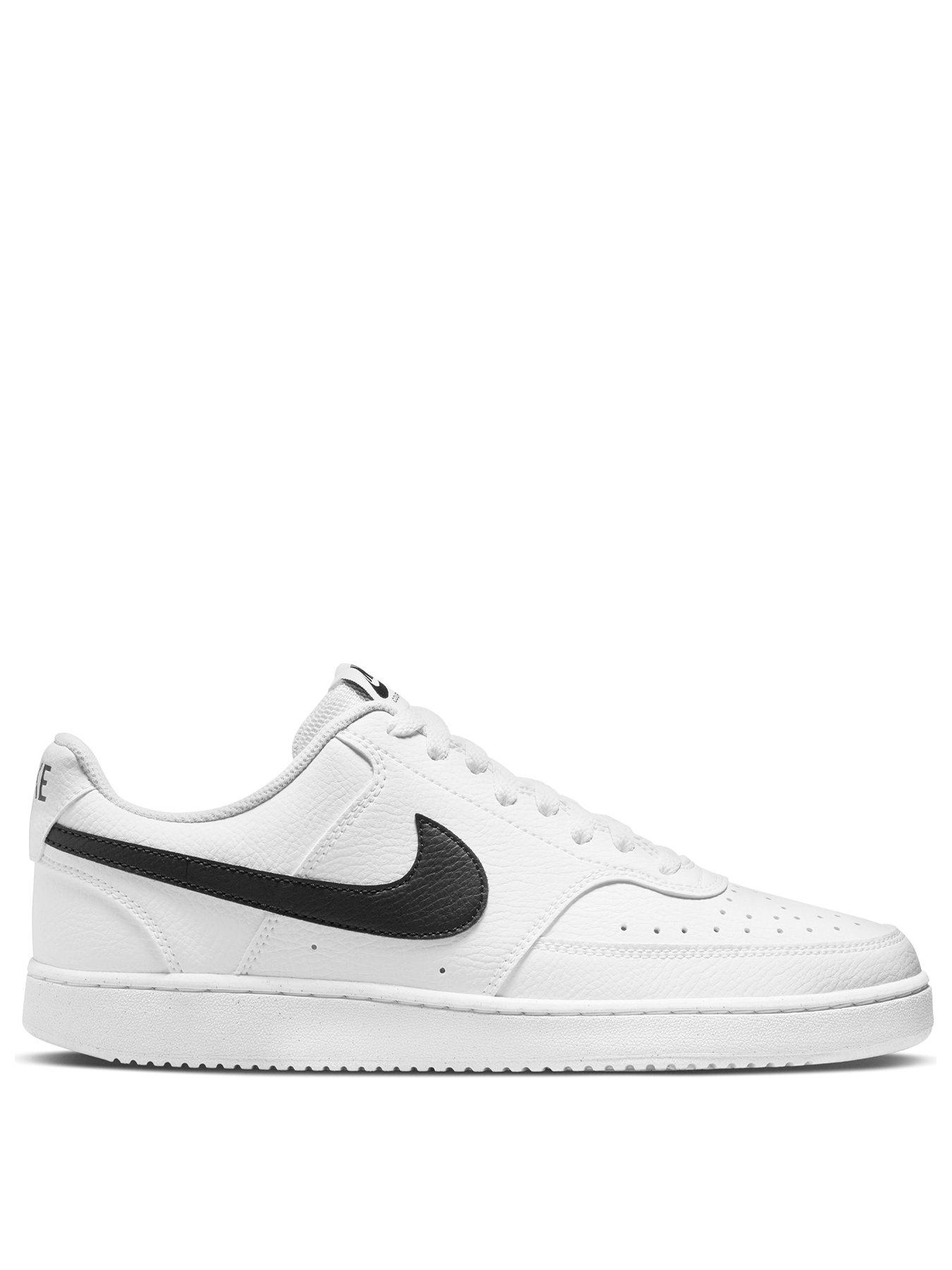 White nike shoes store with black tick