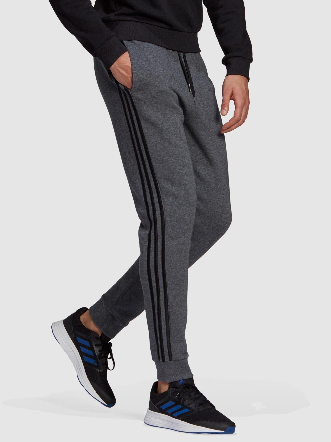 Grey adidas joggers with black online stripes