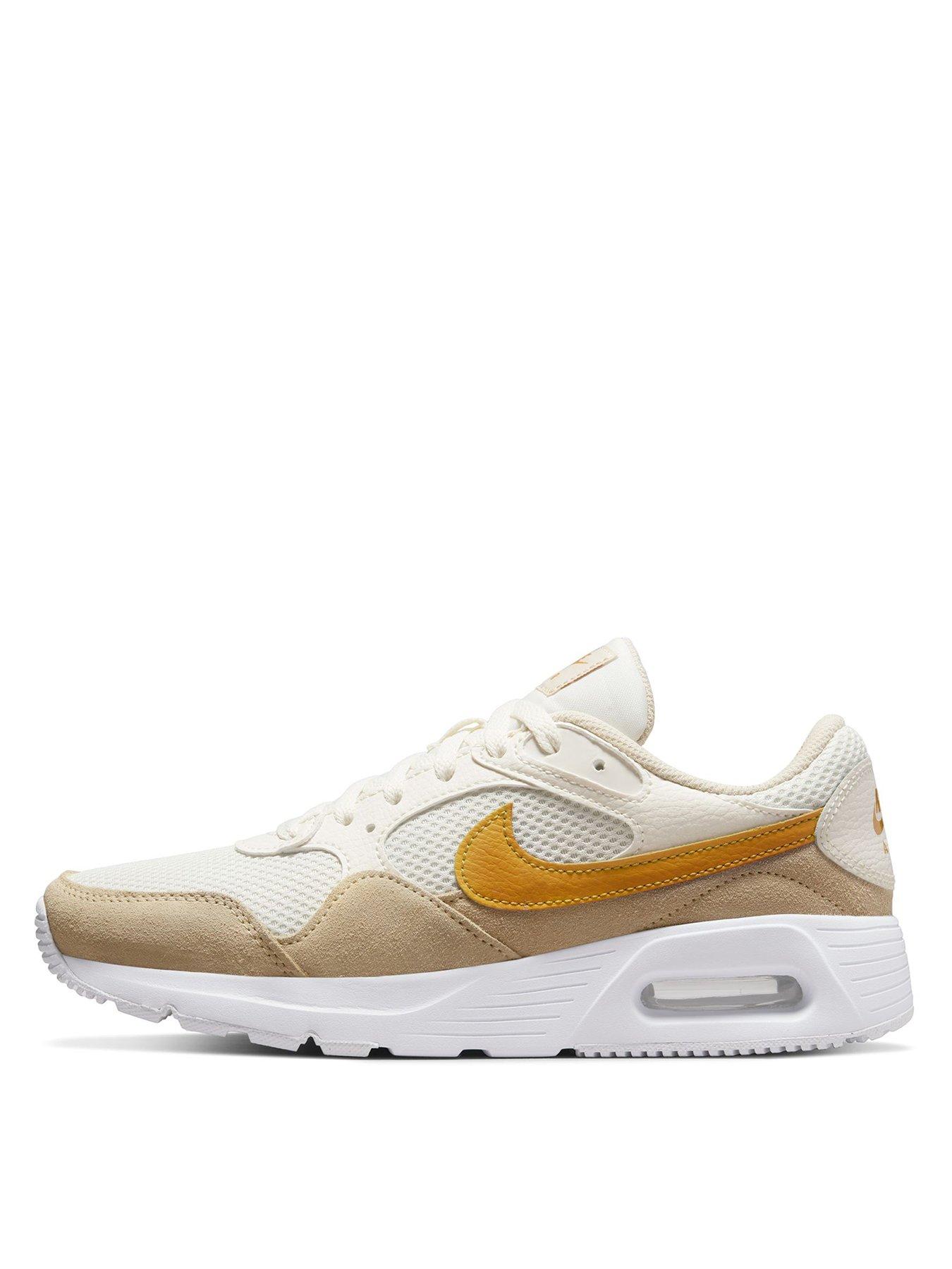 cream nike trainers