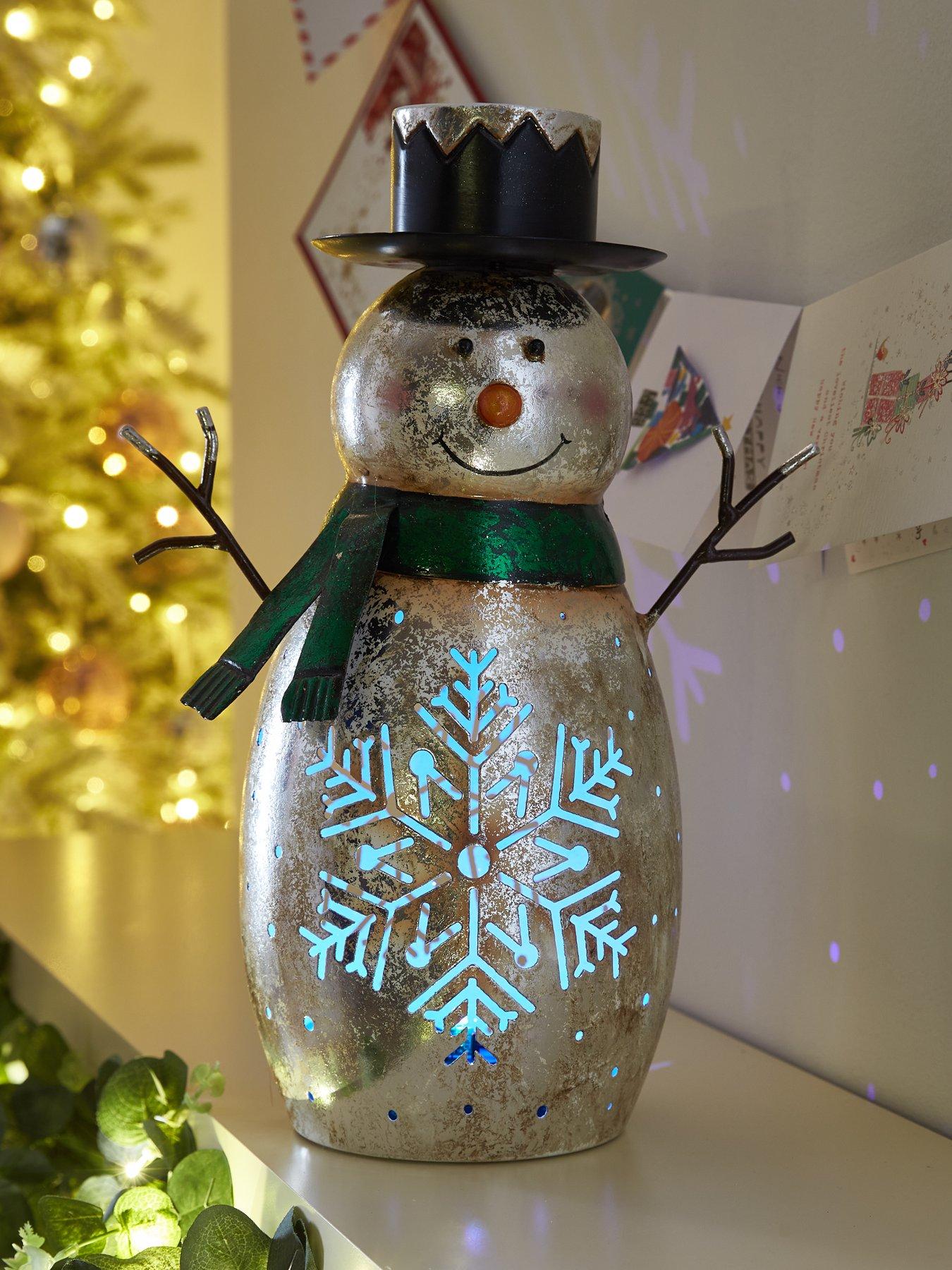 https://media.very.ie/i/littlewoodsireland/UV96M_SQ1_0000000035_SILVER_SLf/festive-34nbspcm-bo-metal-snowman-with-litnbspsnowflake-christmas-decoration.jpg?$180x240_retinamobilex2$