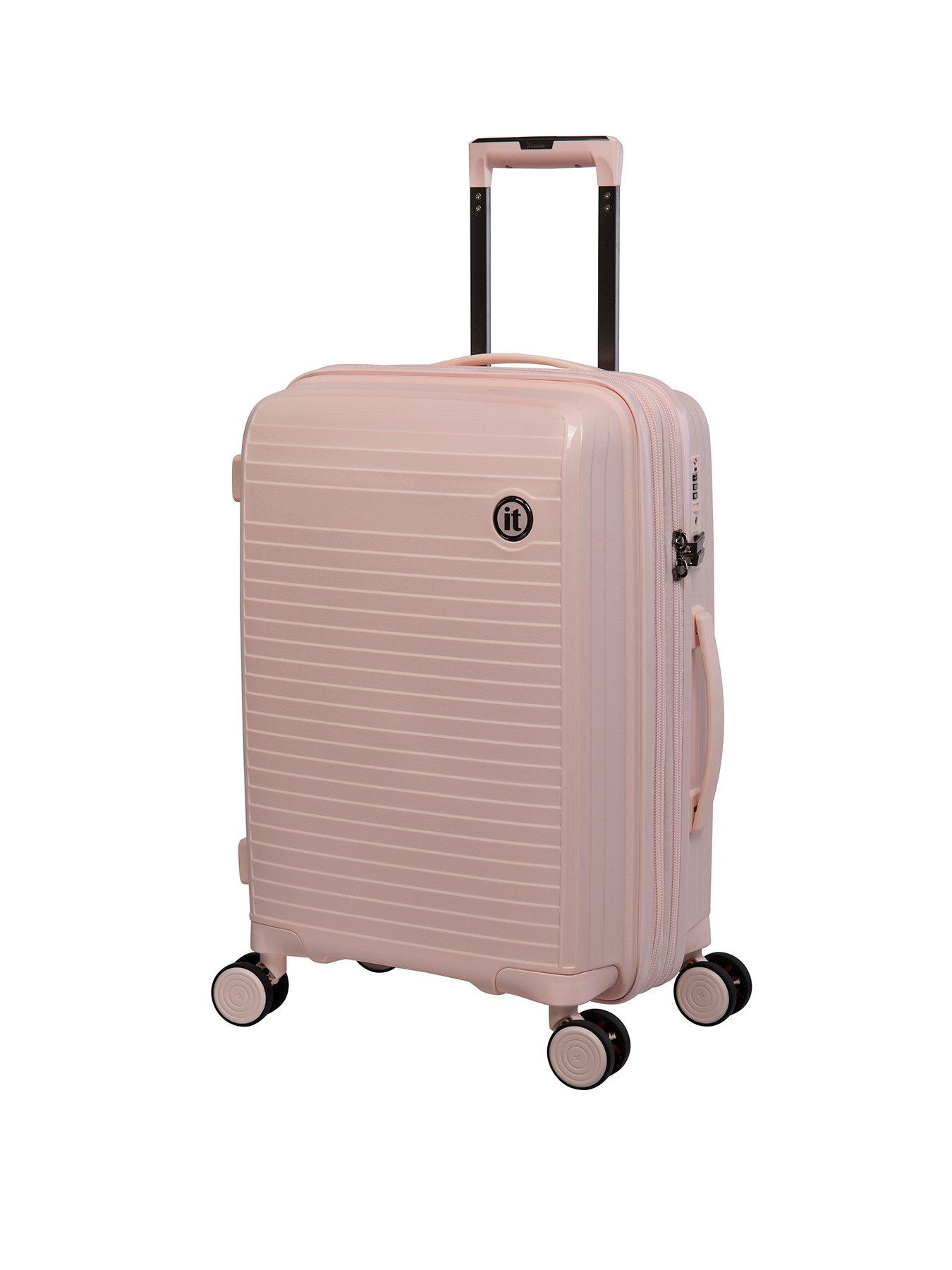 small pink luggage