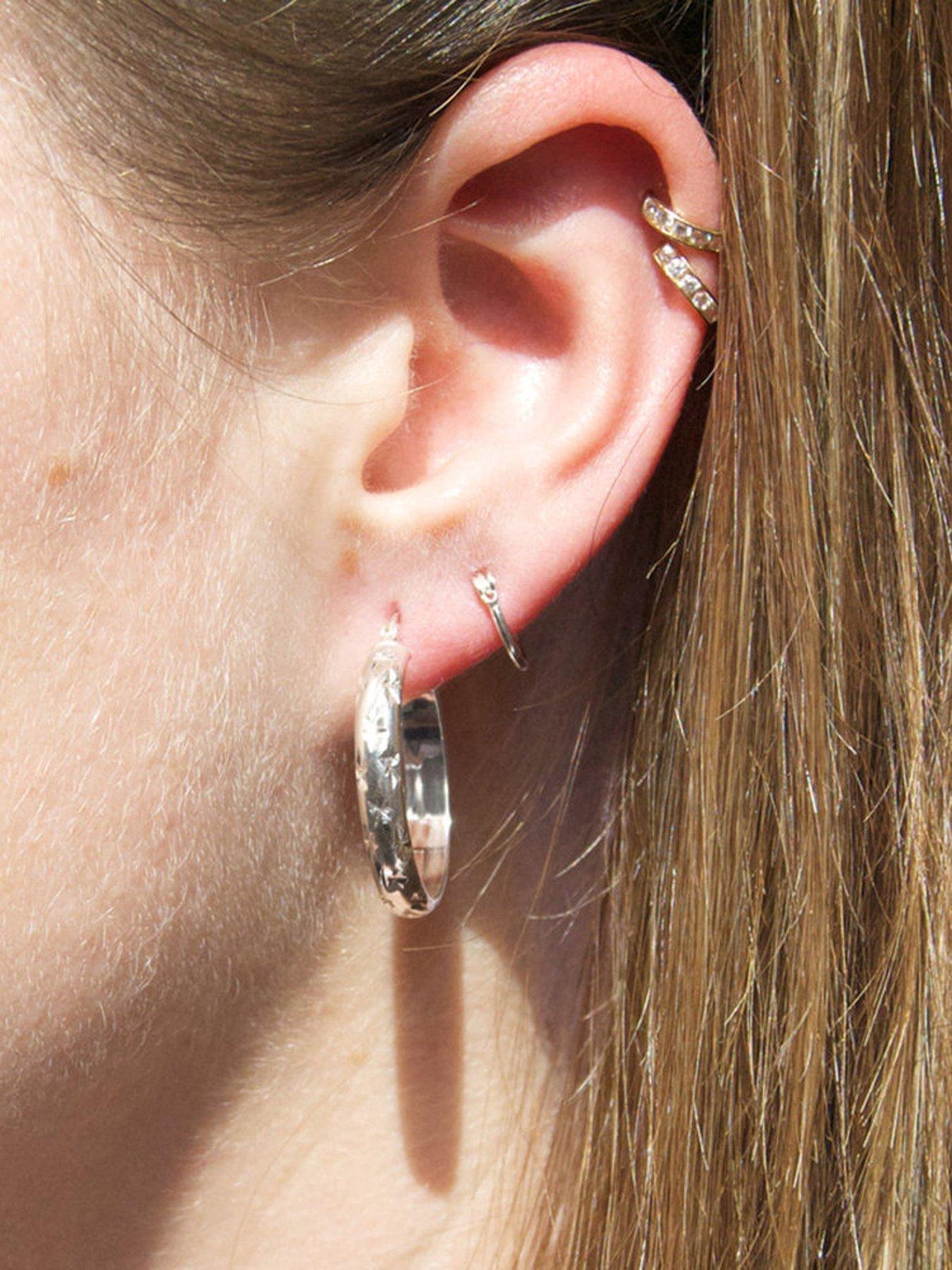Image 2 of 4 of Seol + Gold Sterling Silver Diamond Cut Star Patterned Creole Hoop Earrings