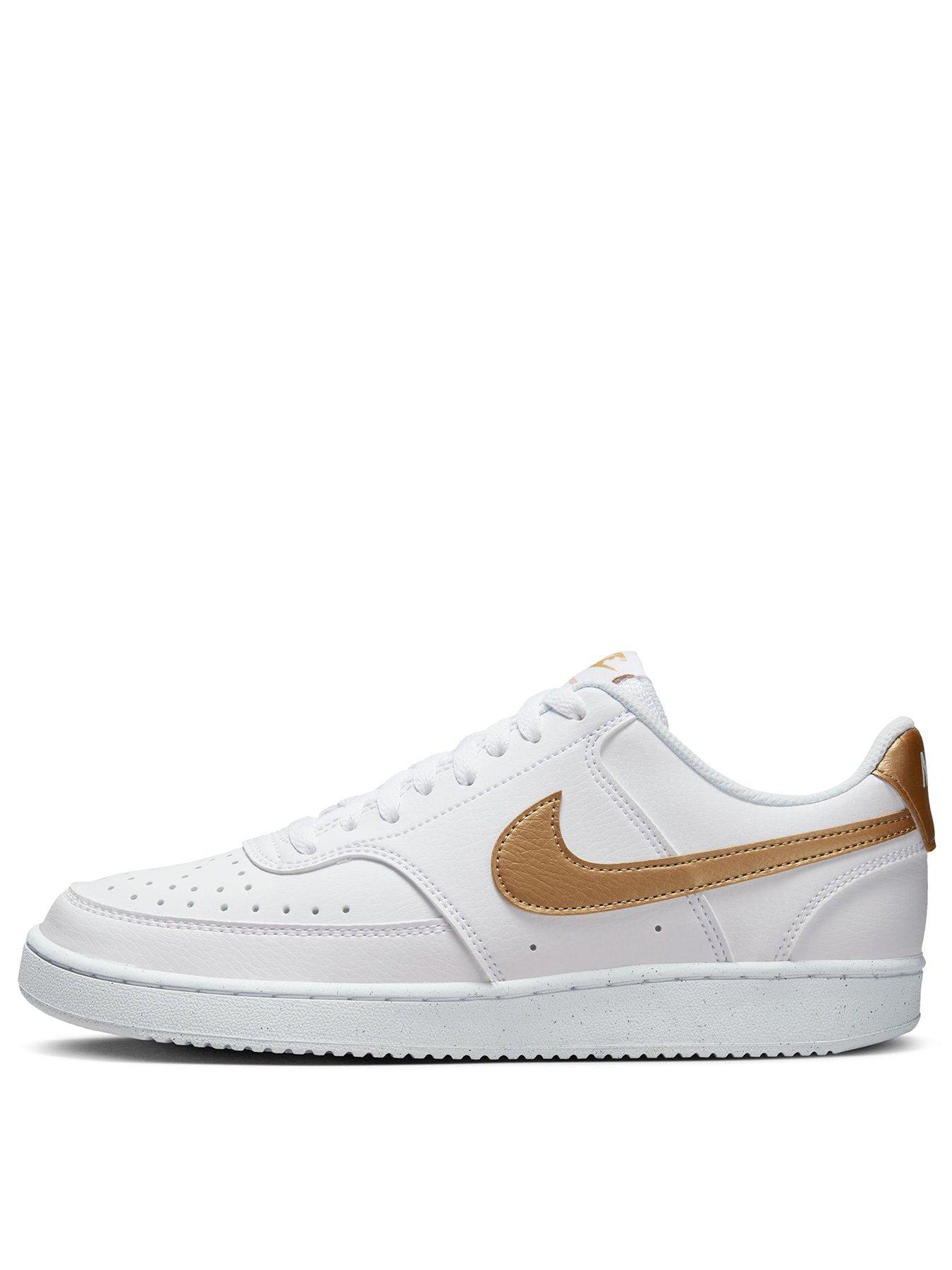 White nike sales trainers gold tick