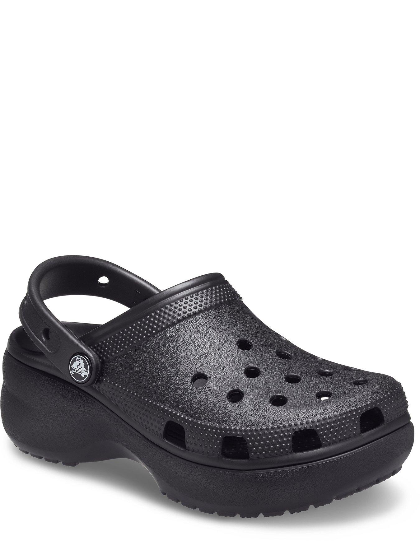 Black platform discount crocs with chain