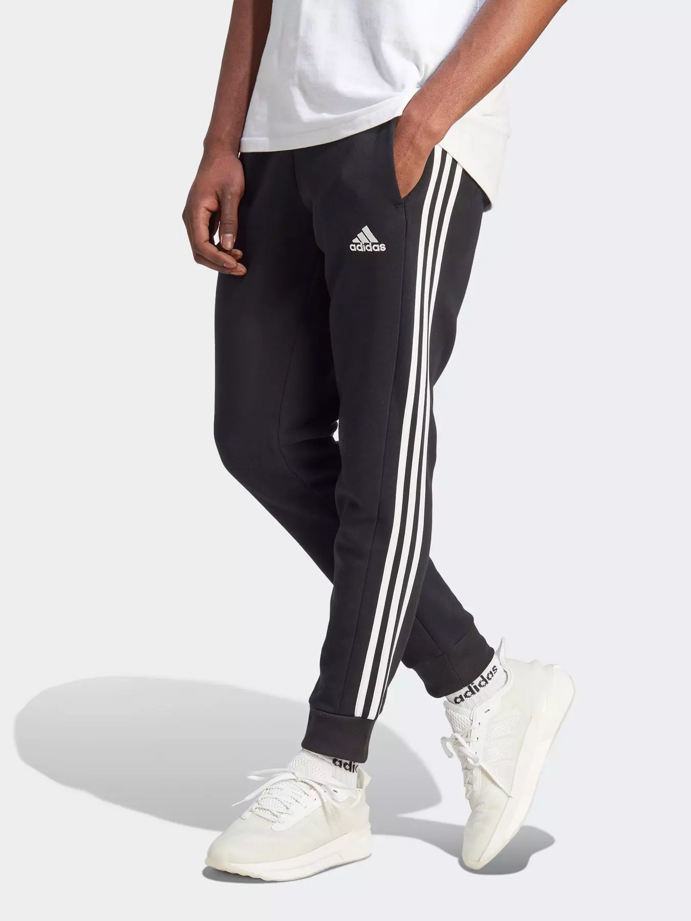 adidas Essentials Animal Print Tricot 3-Stripes Slim Tapered Track Pants -  Black | Women's Lifestyle | adidas US