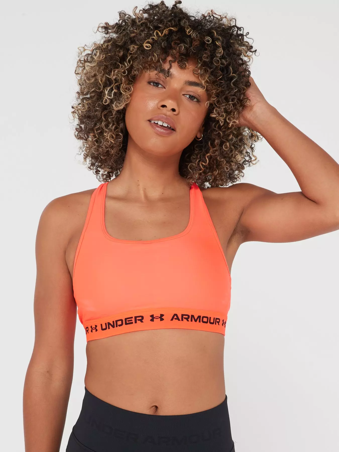 Under Armour Authentics mid support padless sports bra in blue and pink
