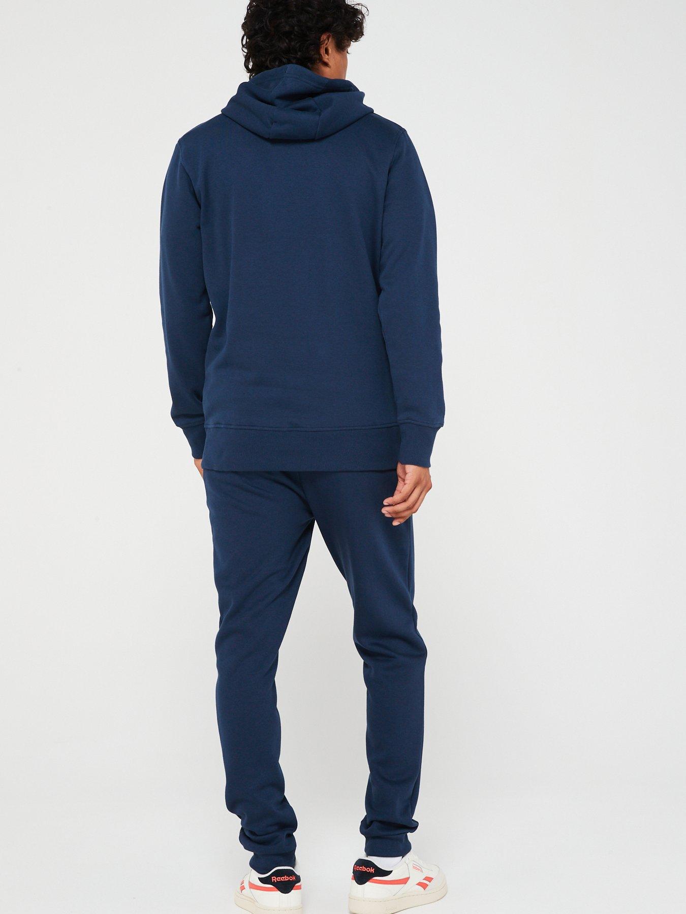 ellesse-sucre-tracksuit-navystillFront