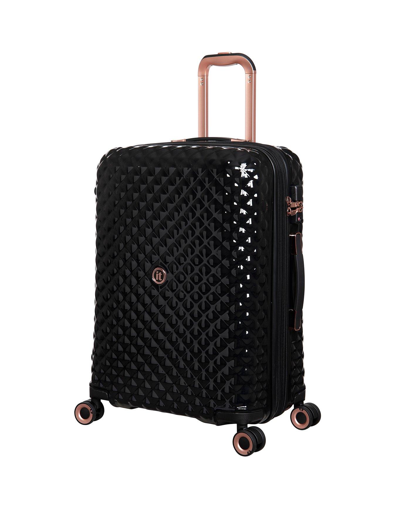 It rose gold store and black suitcase