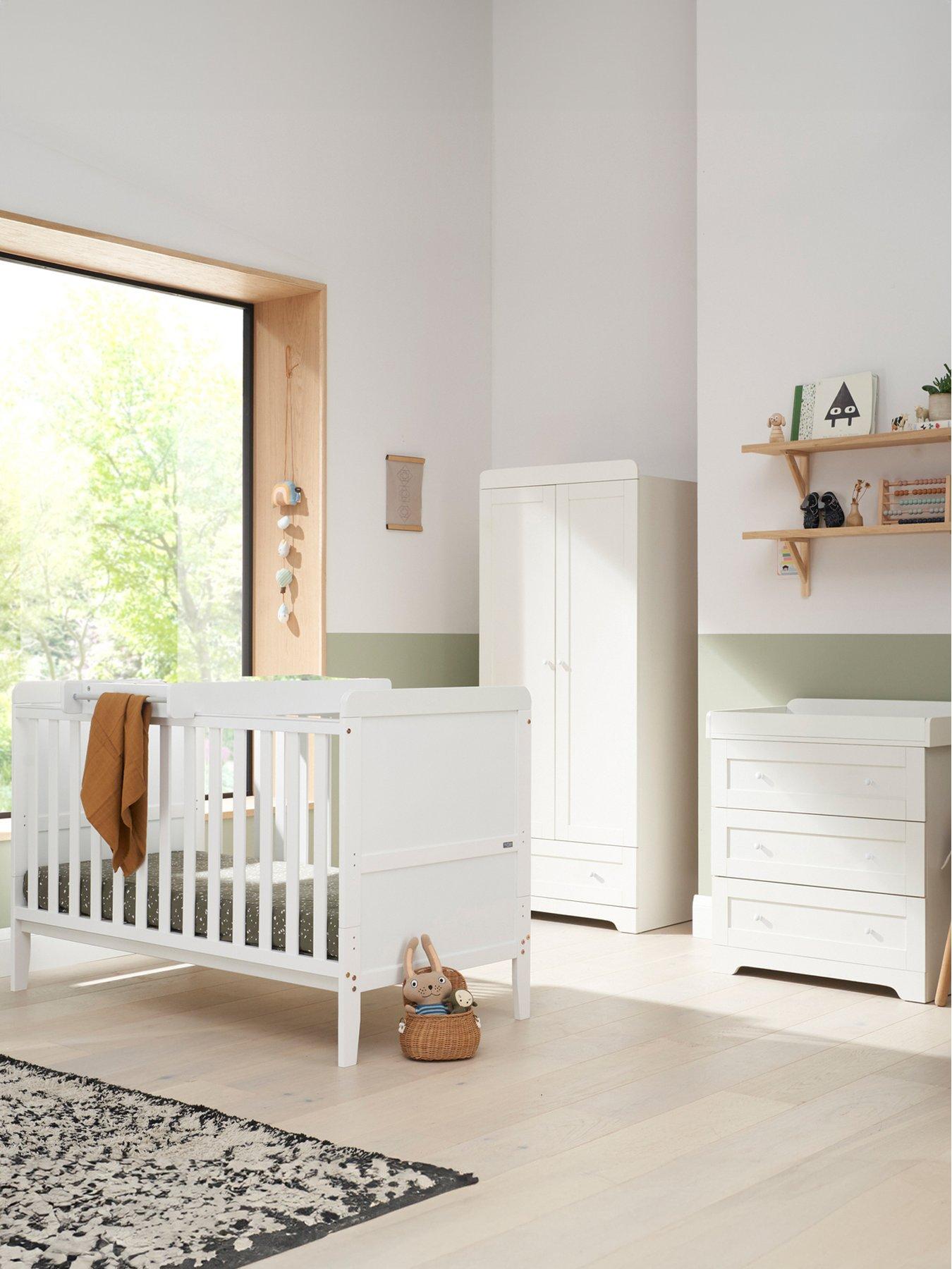 Cot bed with drawer and changer on outlet top