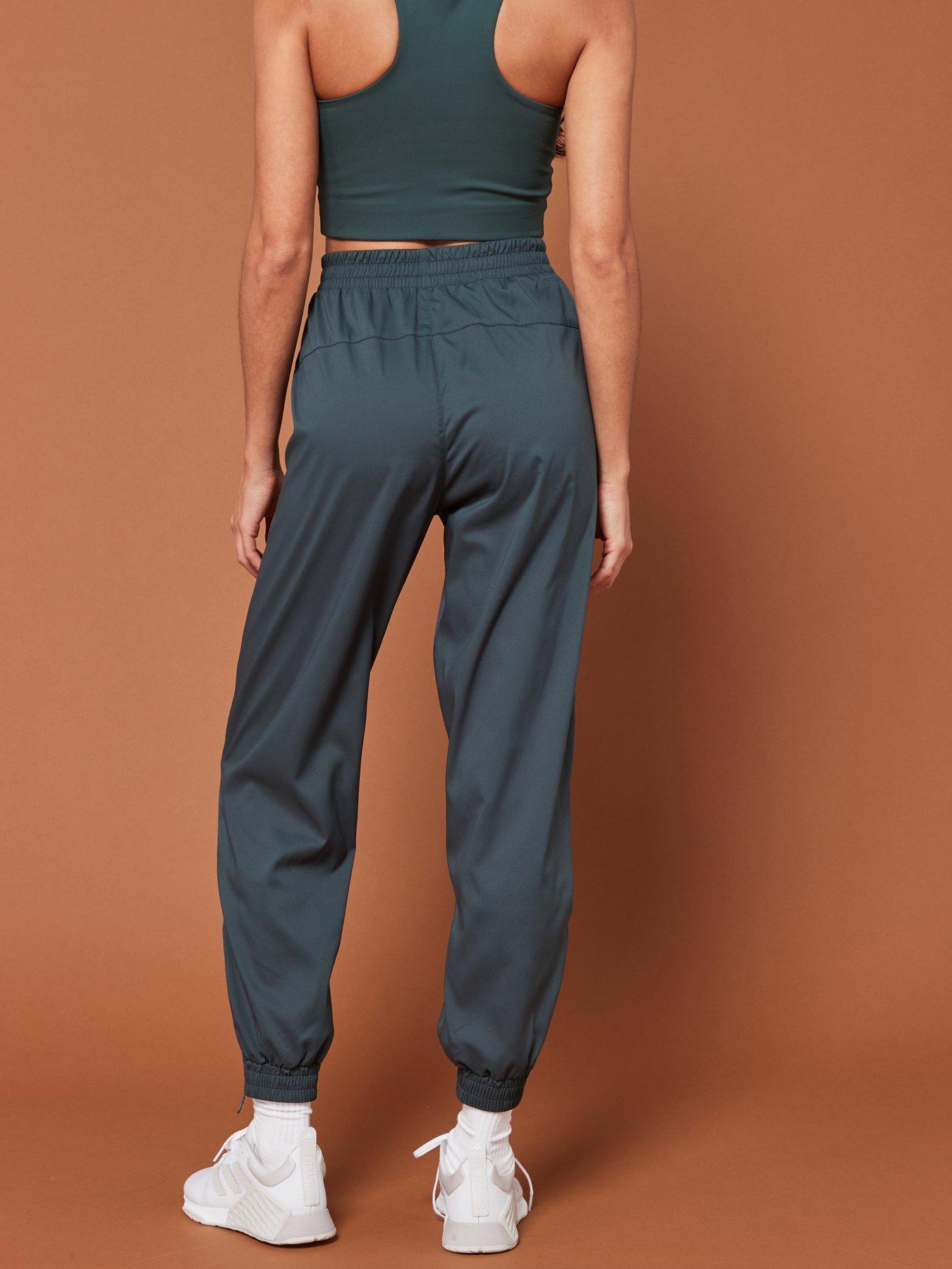 girlfriend-collective-womens-training-summit-track-pants-greenstillFront