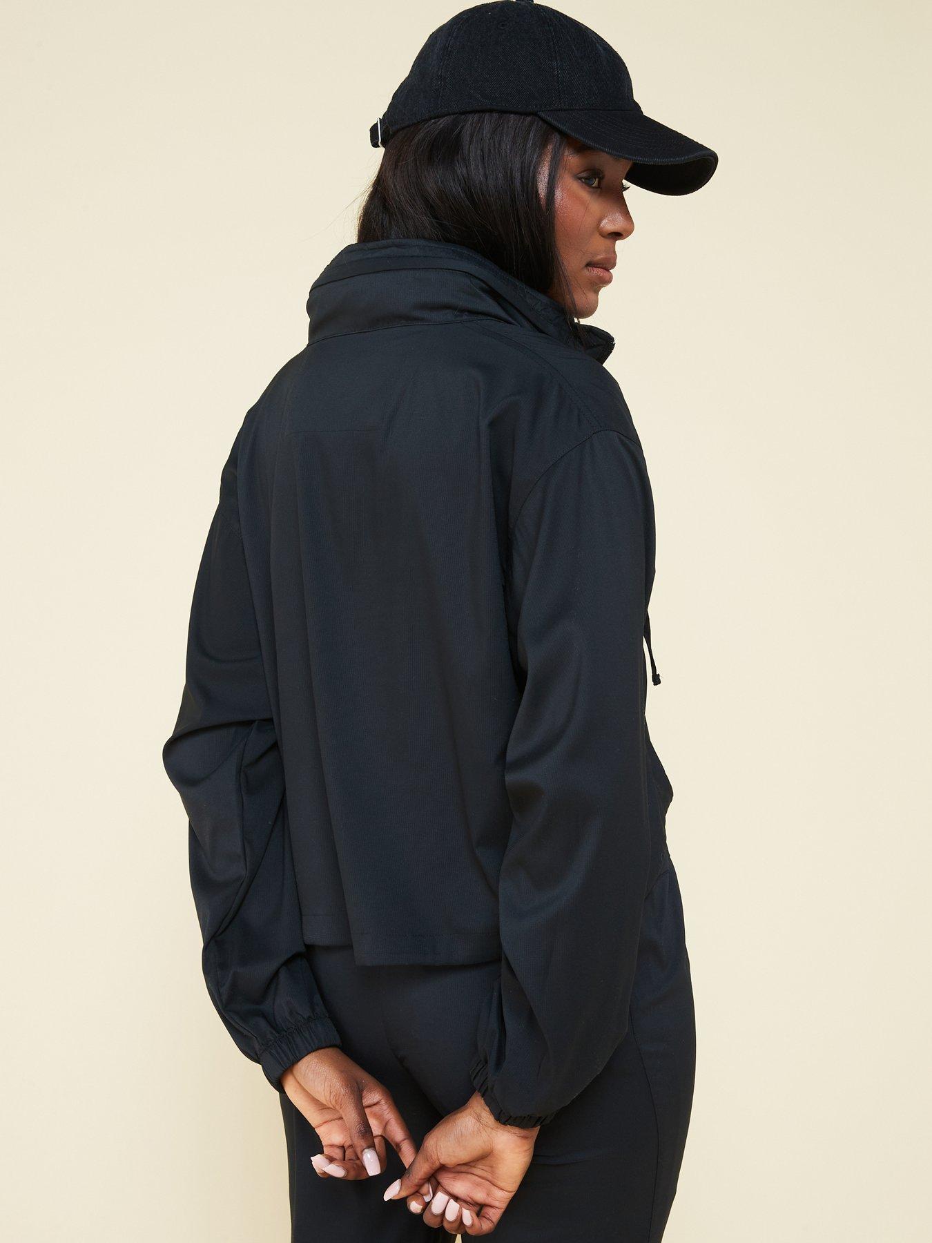 girlfriend-collective-womens-training-hummingbird-half-zip-windbreaker-blackstillFront