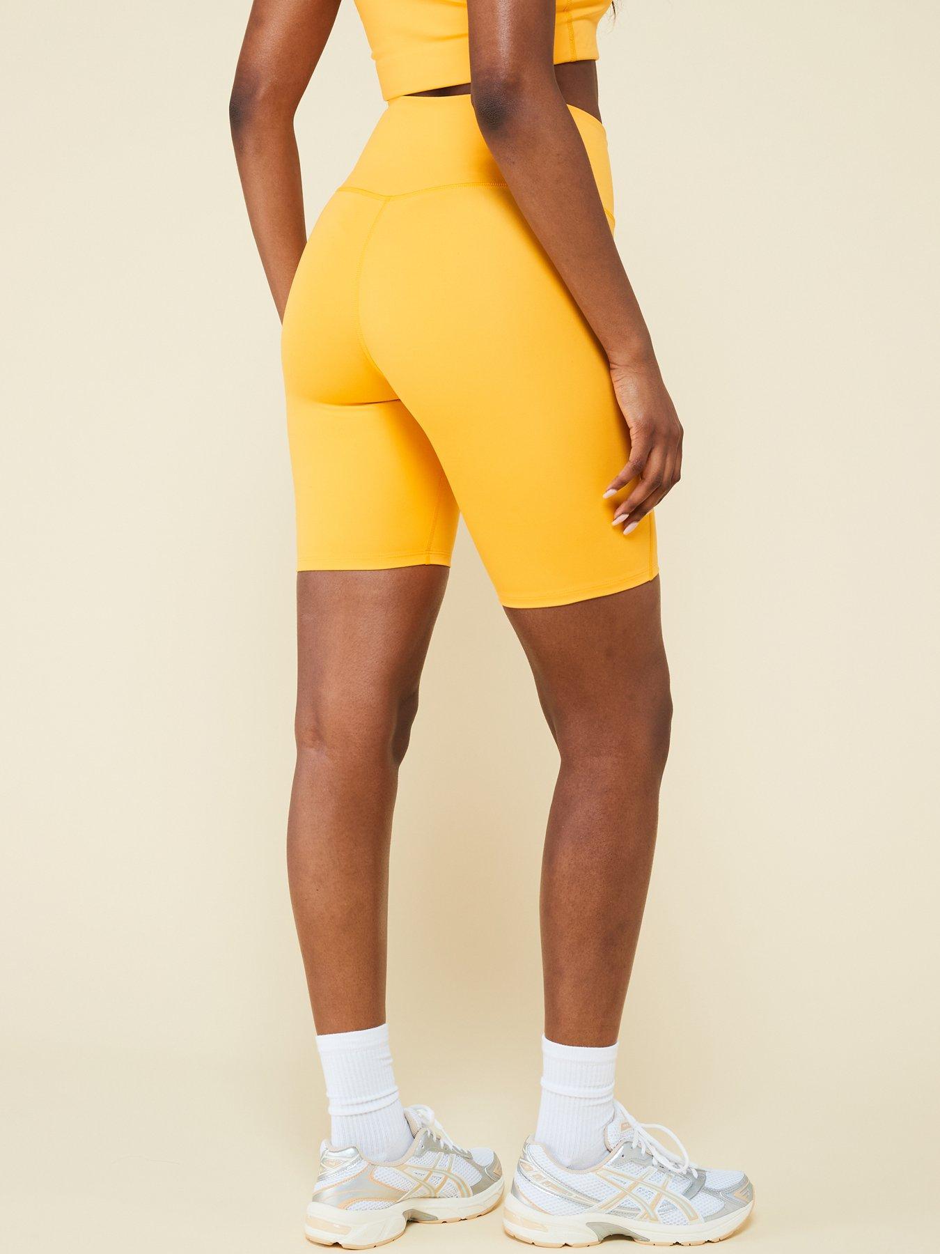 girlfriend-collective-womens-training-compressive-high-rise-bike-shorts-yellowstillFront