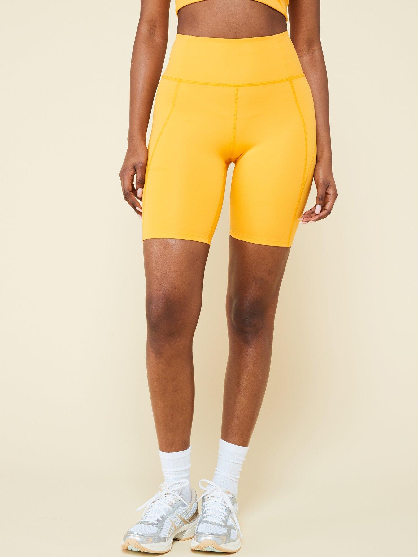 girlfriend-collective-womens-training-compressive-high-rise-bike-shorts-yellowback