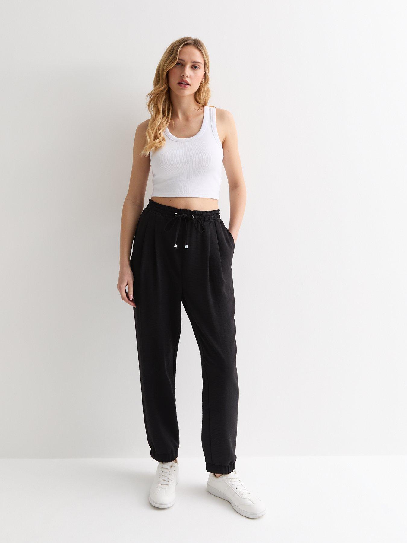 Black joggers with white drawstring on sale