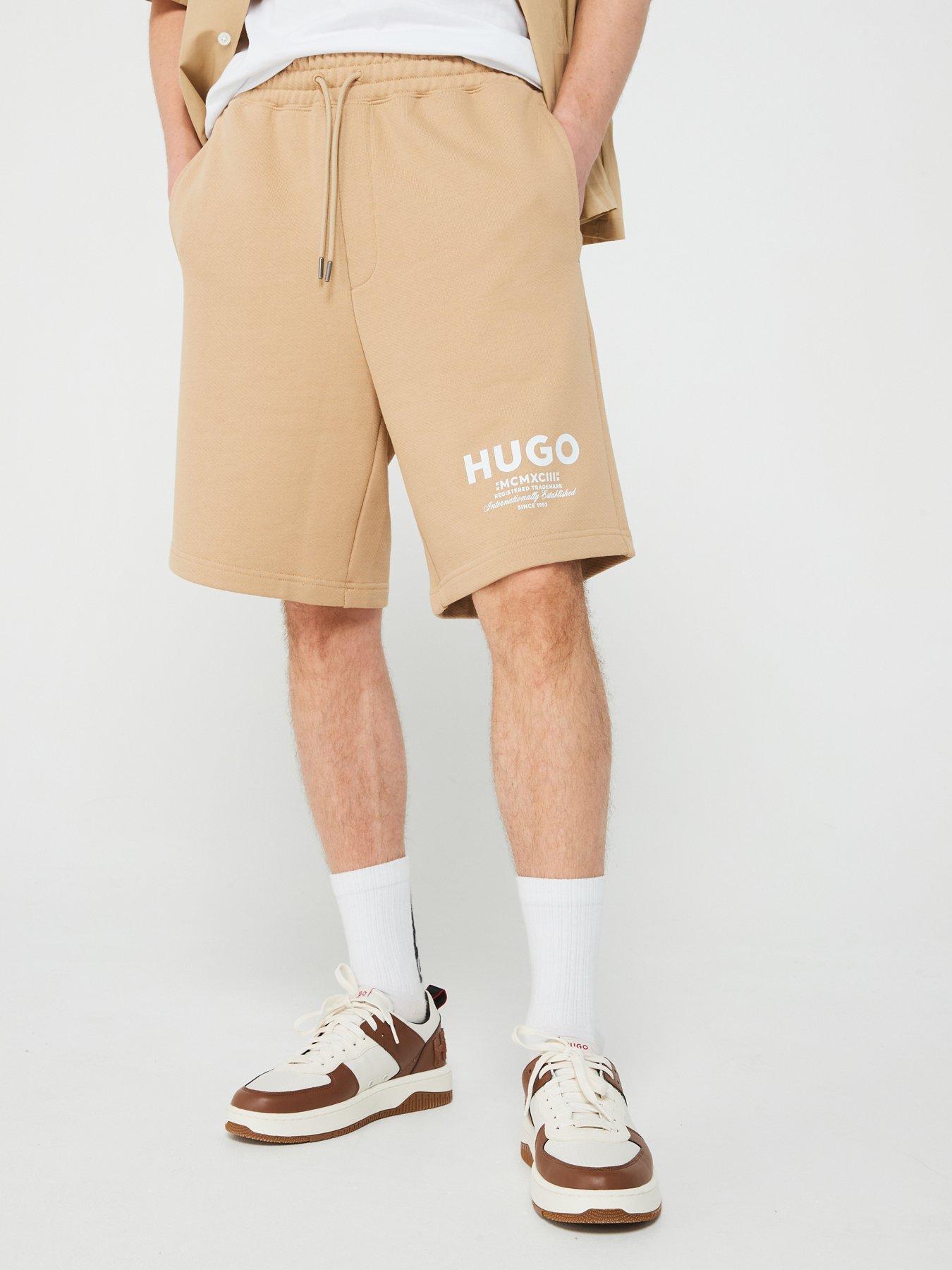 hugo-blue-nomario-oversized-international-logo-jersey-shorts-beige