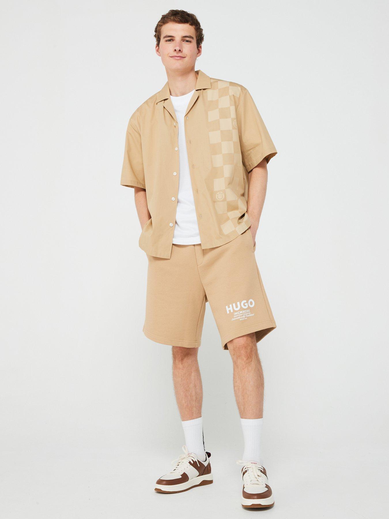 hugo-blue-nomario-oversized-international-logo-jersey-shorts-beigeback