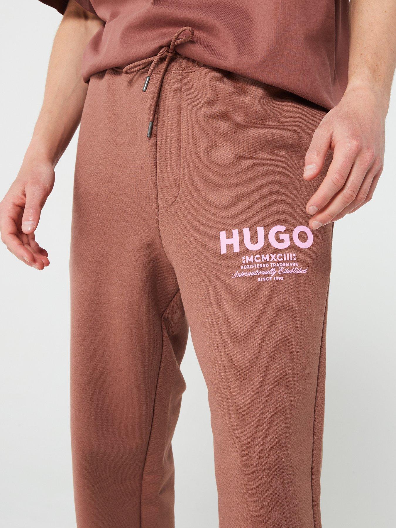 hugo-blue-nevez-oversized-international-logo-cuff-joggers-brownoutfit