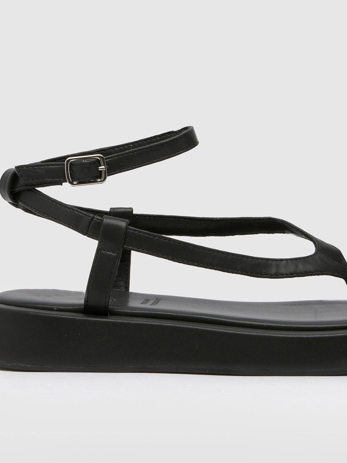 schuh-torin-toe-thong-ankle-strap-sandal-blackstillFront