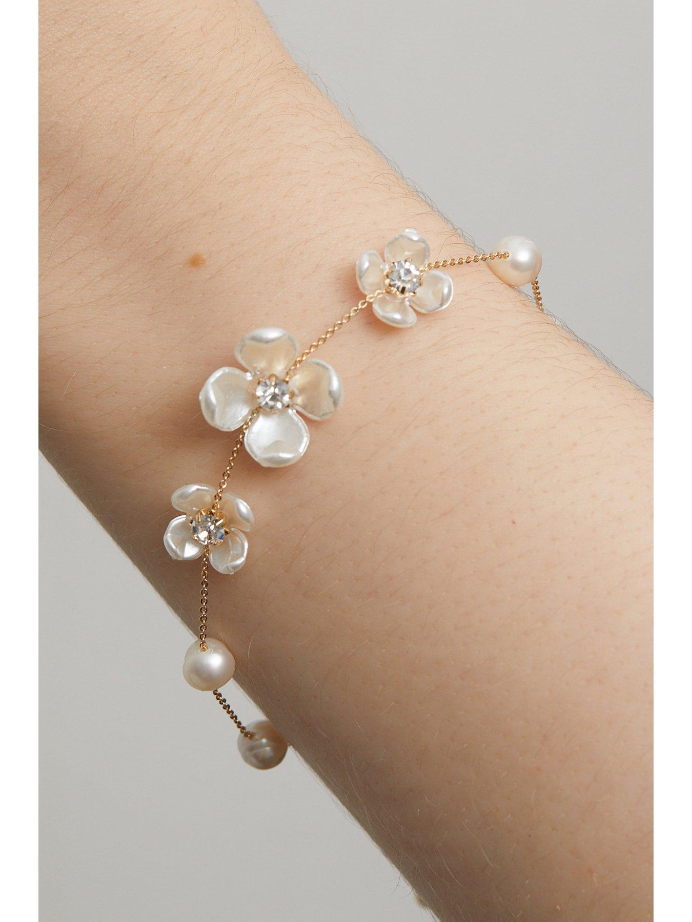 jon-richard-gold-plated-white-floral-and-freshwater-pearl-braceletstillFront