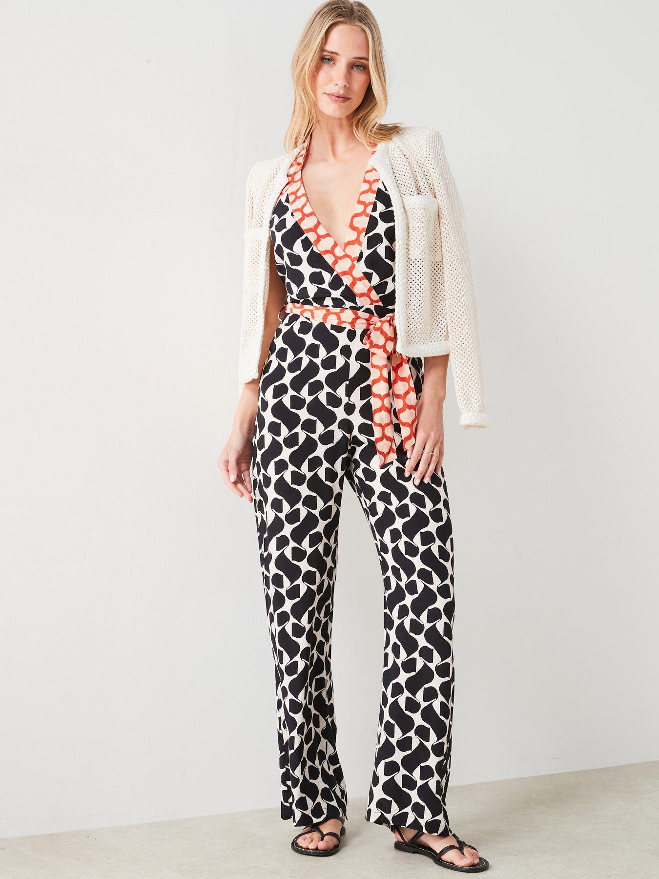Image 1 of 6 of Mango Printed Jumpsuit With Bow - Black