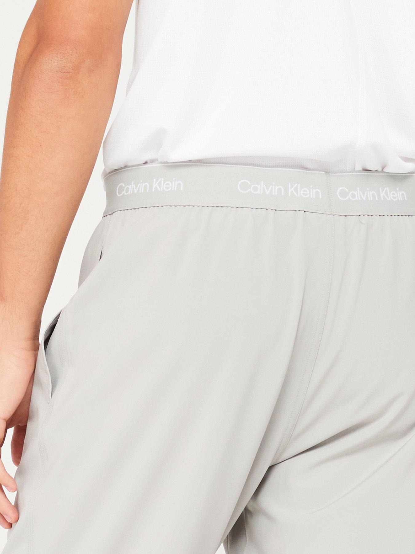 calvin-klein-sport-calvin-klein-sport-waistband-logo-open-hen-track-trousers-light-greyoutfit