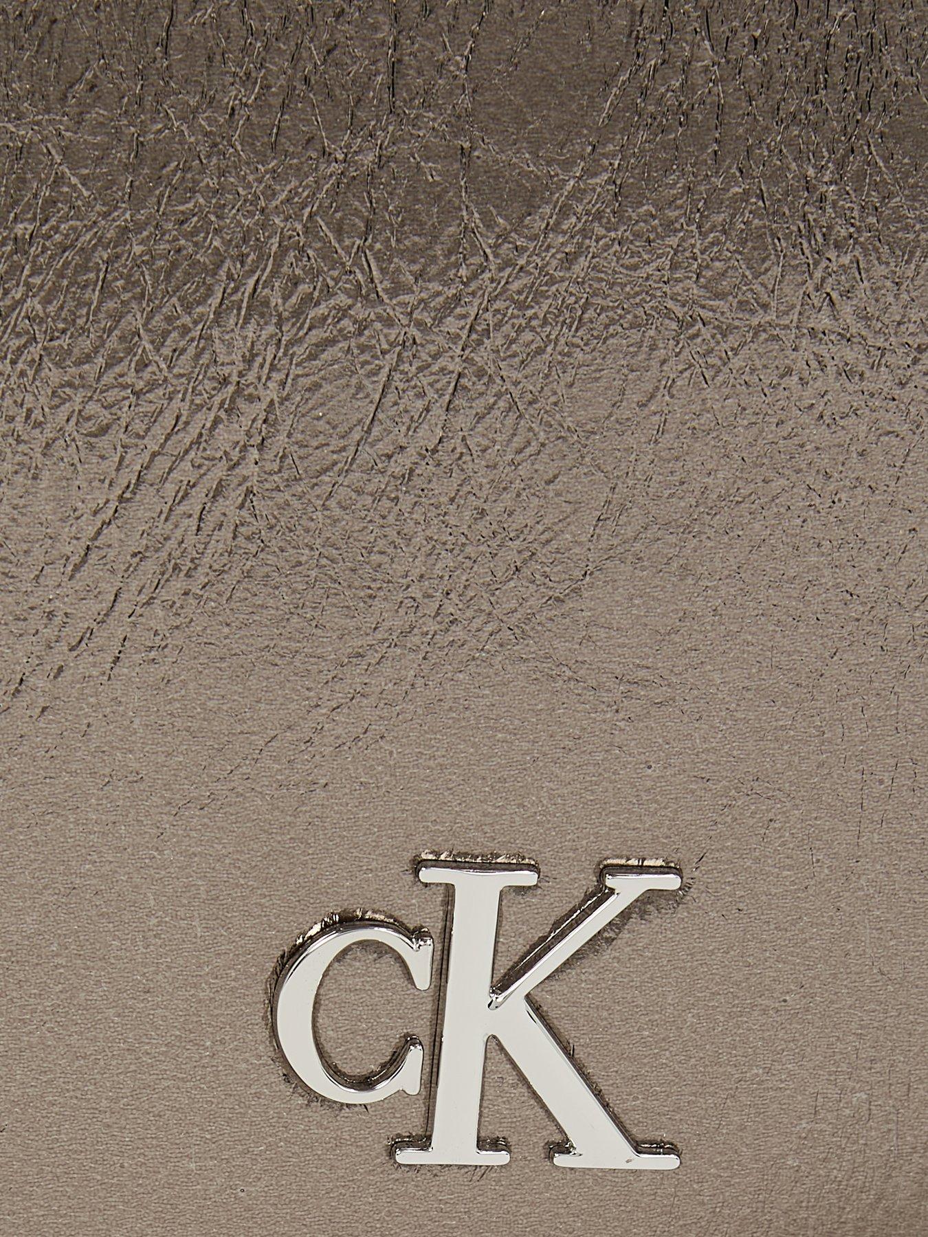 calvin-klein-jeans-monogram-saddle-crossbody-bag-silveroutfit