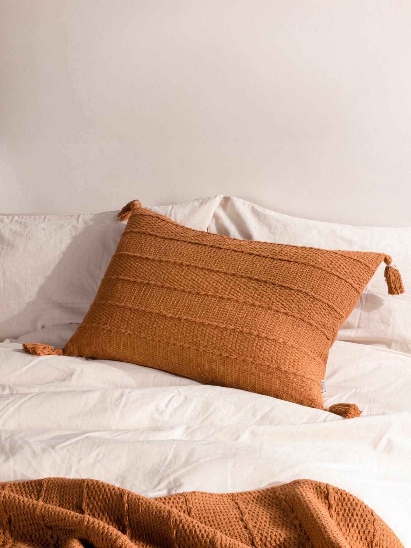 the-yard-caliche-cushion-gingerfront