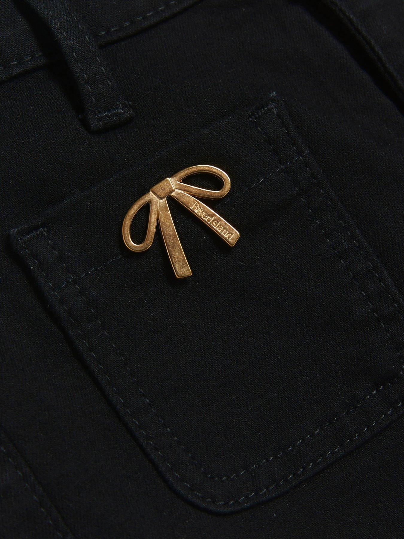 Image 4 of 4 of River Island Bow Detail Flared Jeans - Black