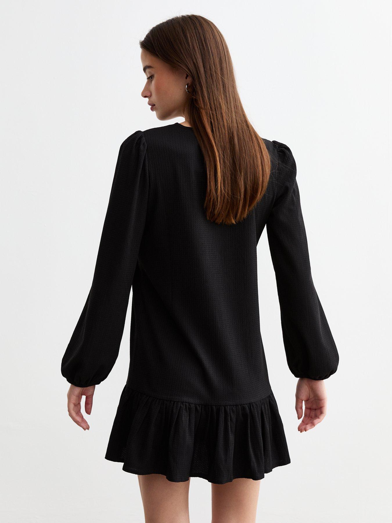 new-look-textured-frill-hem-long-sleeved-mini-dress-blackstillFront