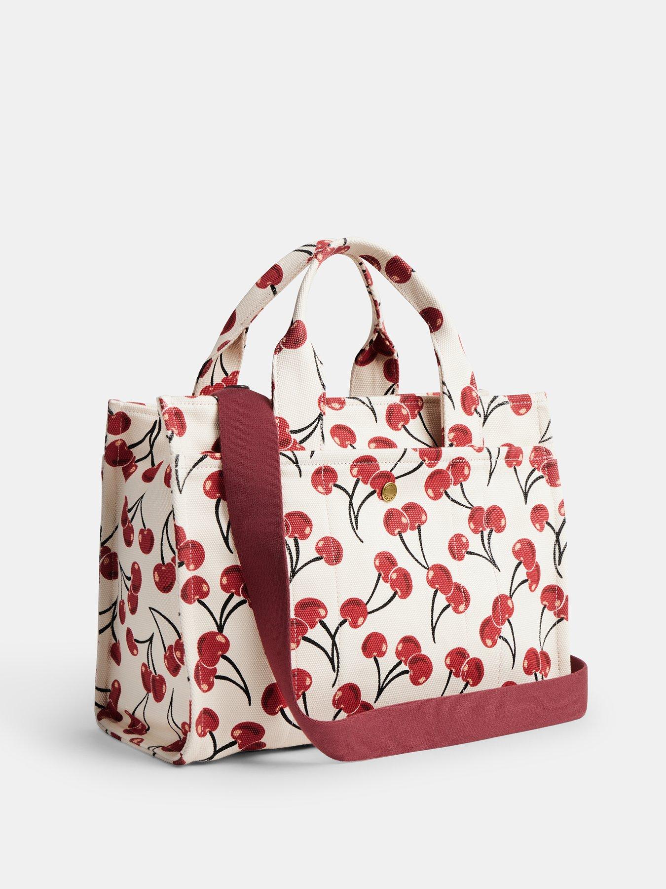 coach-cherry-print-cargo-tote-creamoutfit