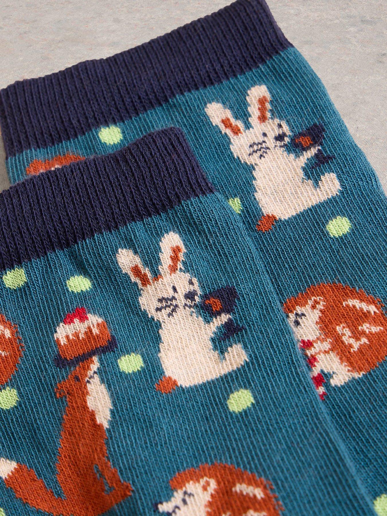 white-stuff-animal-sock-in-a-cracker-greenstillFront