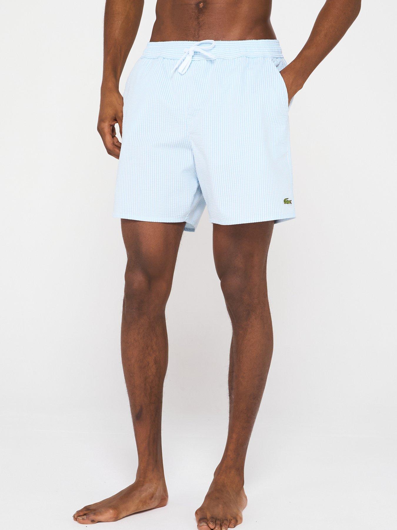 Image of Lacoste Striped Seersucker Swim Trunks - Blue