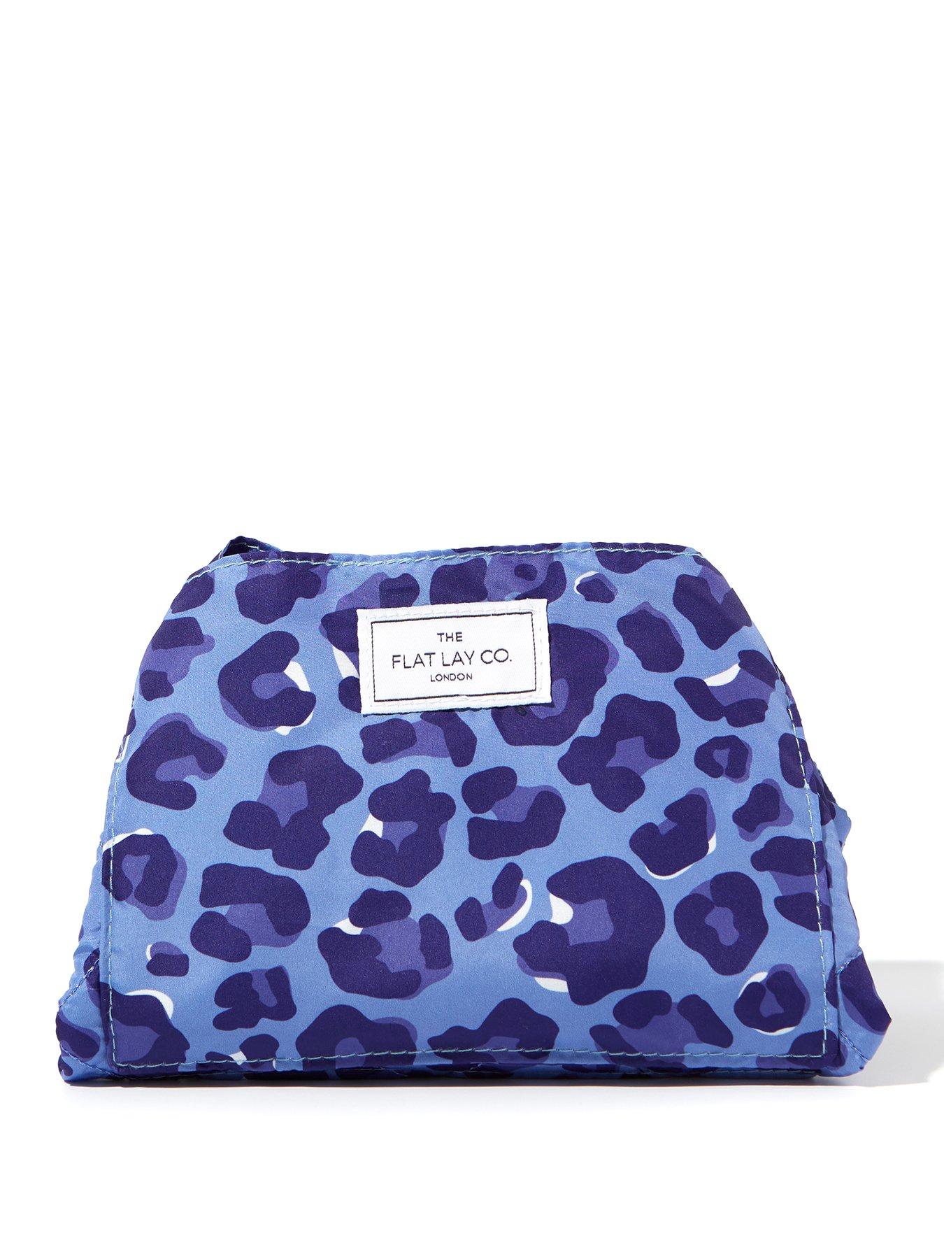Image 1 of 6 of The Flat Lay Co. Drawstring Makeup Bag in Blue Leopard
