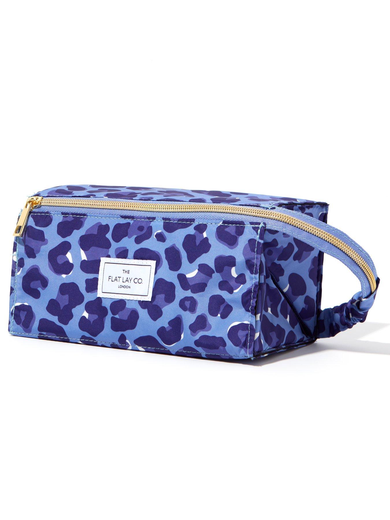 the-flat-lay-co-makeup-box-bag-in-blue-leopardstillFront