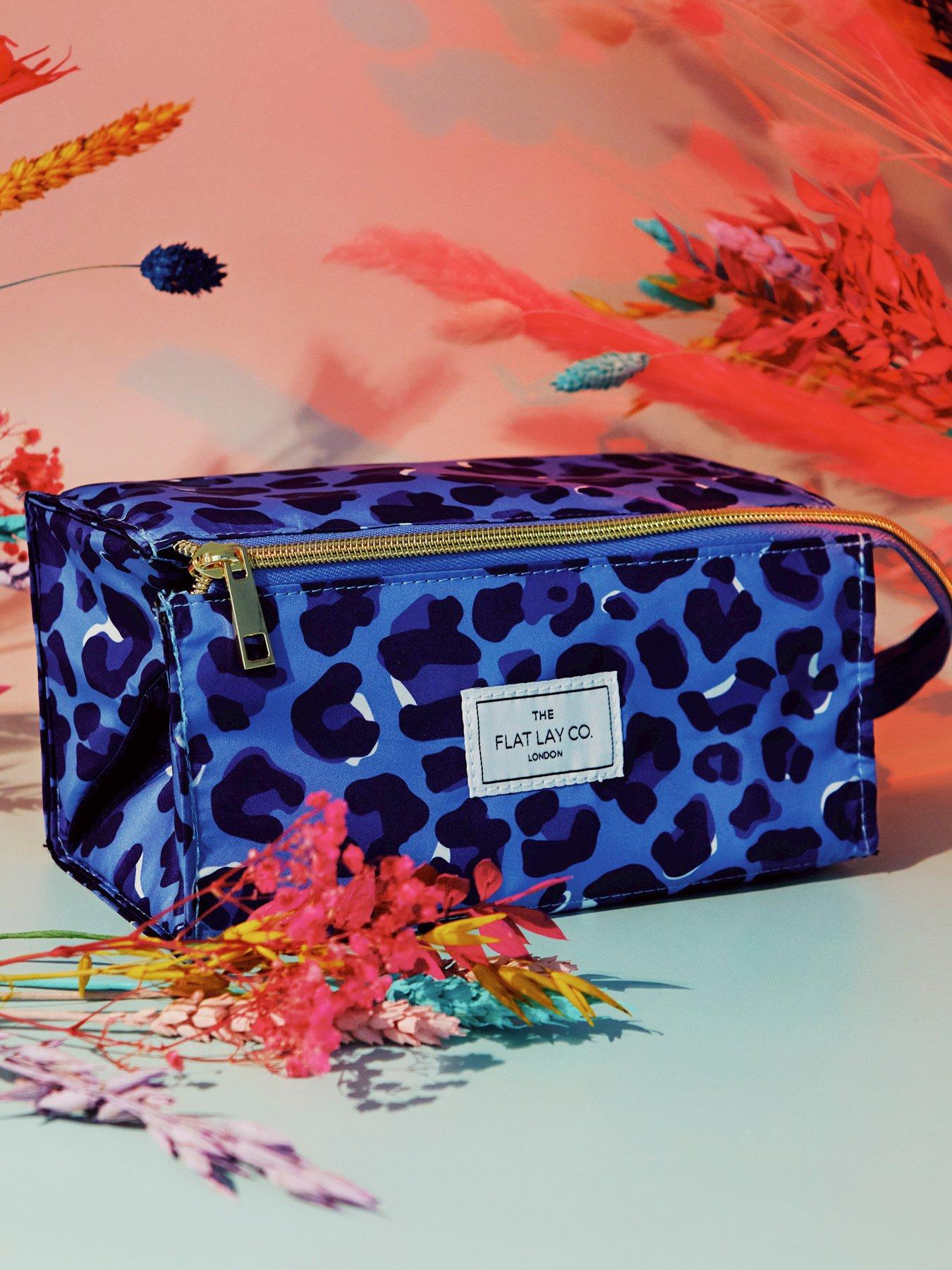 the-flat-lay-co-makeup-box-bag-in-blue-leopardoutfit