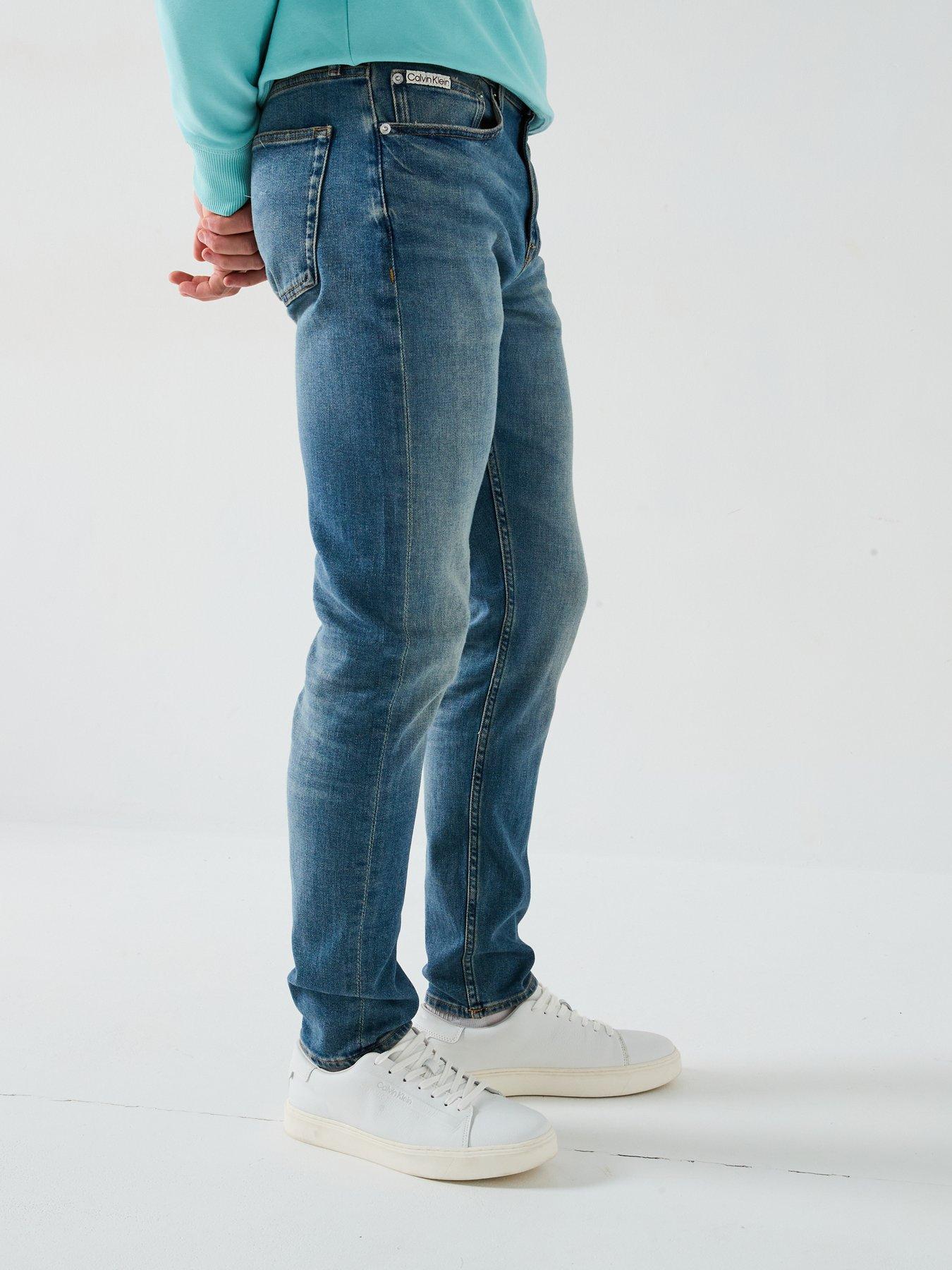 Image 6 of 6 of Calvin Klein Jeans Slim Taper Jeans - Dark Wash