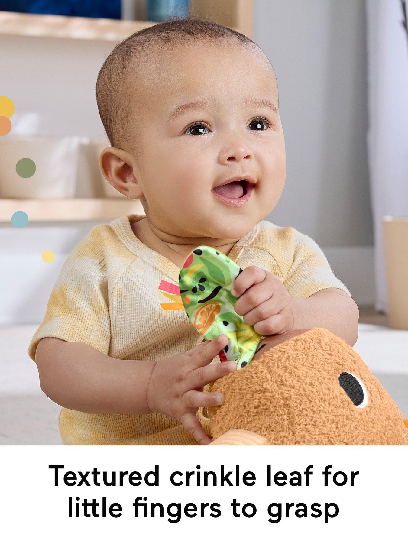 Image 3 of 7 of Fisher-Price Snuggly Snacky Capybara Plush Baby Sensory Toy with Teether &amp; Rattle for Newborns