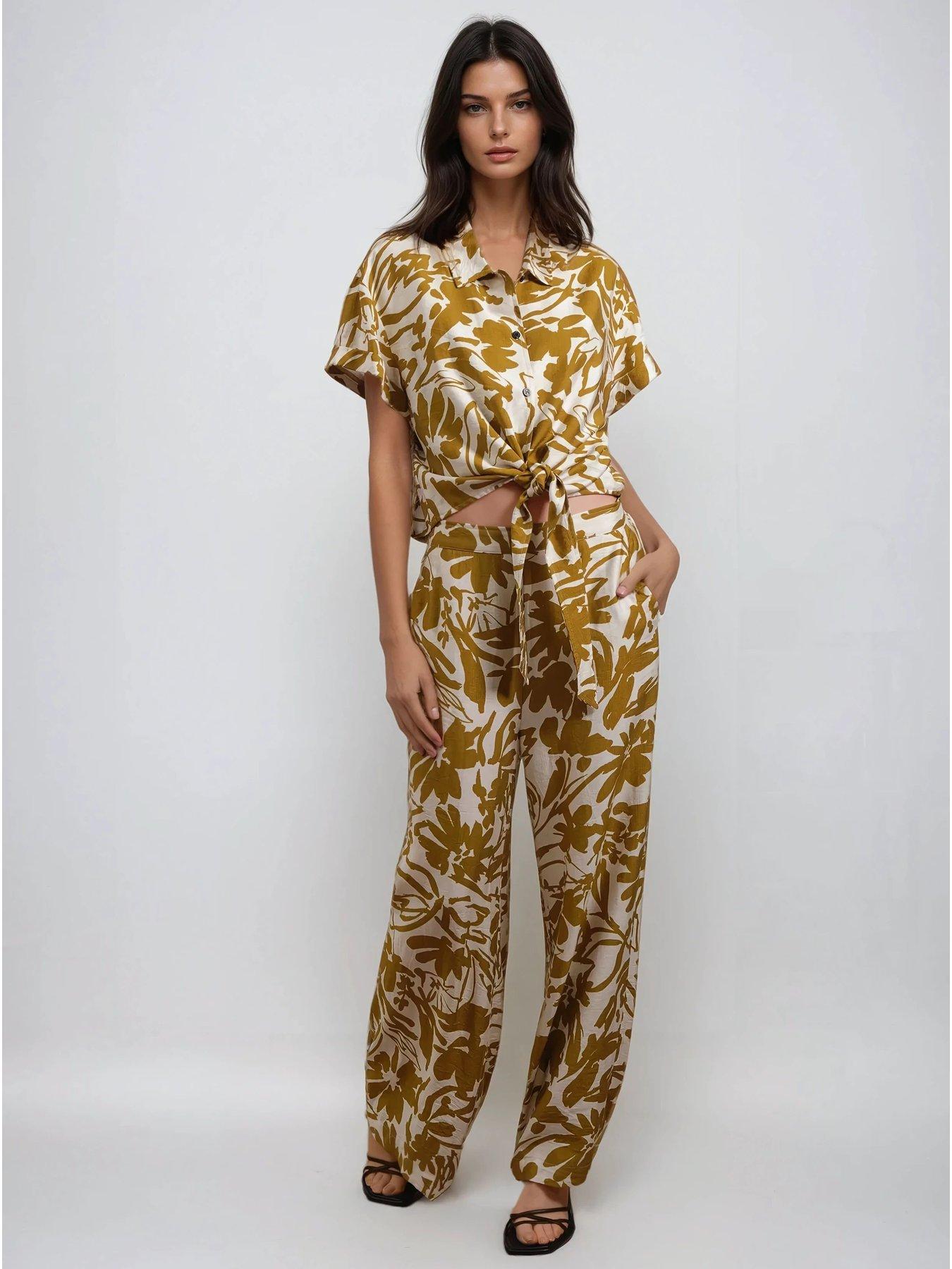 religion-element-trousers-in-bright-floral-print-yellowoutfit