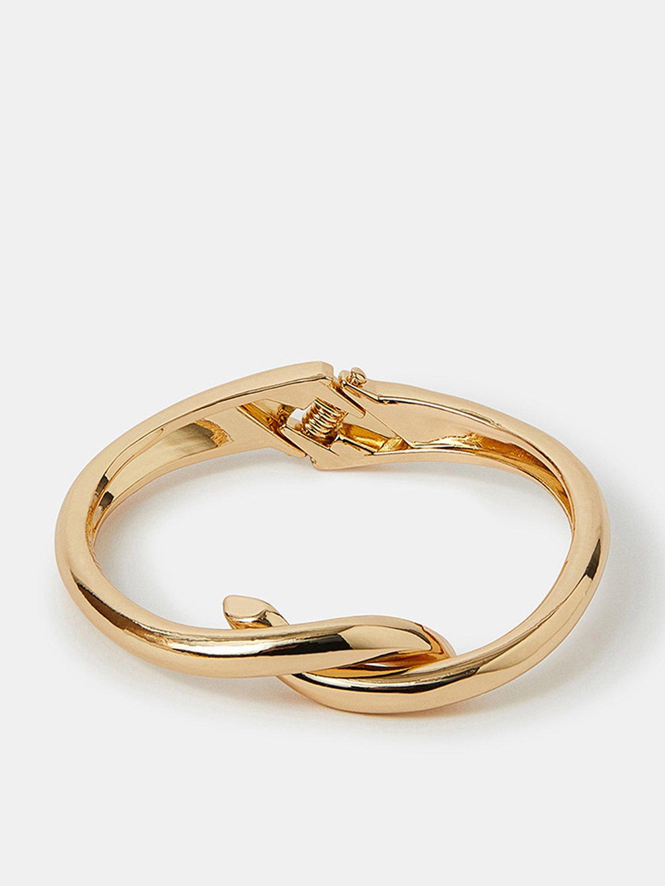 Image 1 of 3 of Accessorize Twist Knot Bangle Gold