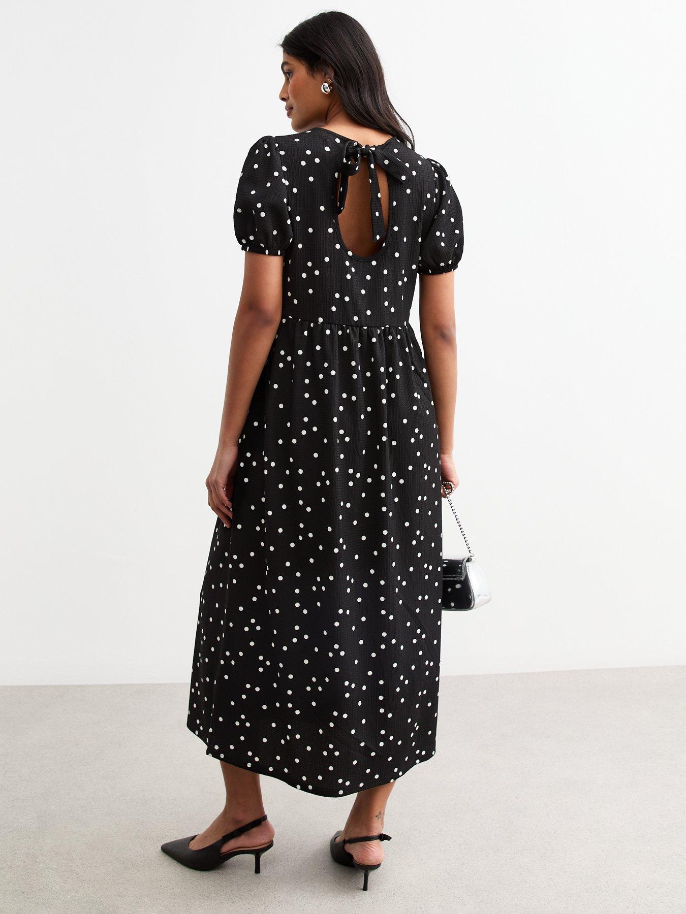 Image 2 of 4 of New Look Crinkled Jersey Polka Dot Bow Back Midi Dress - Black