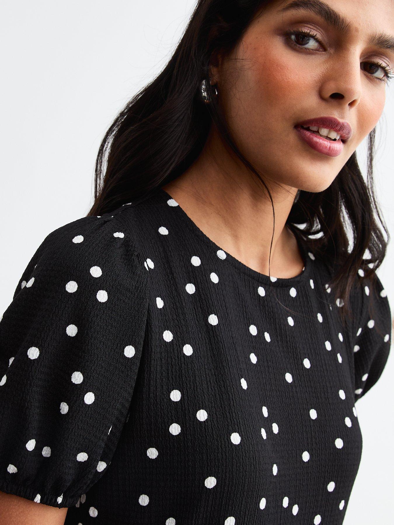 Image 4 of 4 of New Look Crinkled Jersey Polka Dot Bow Back Midi Dress - Black