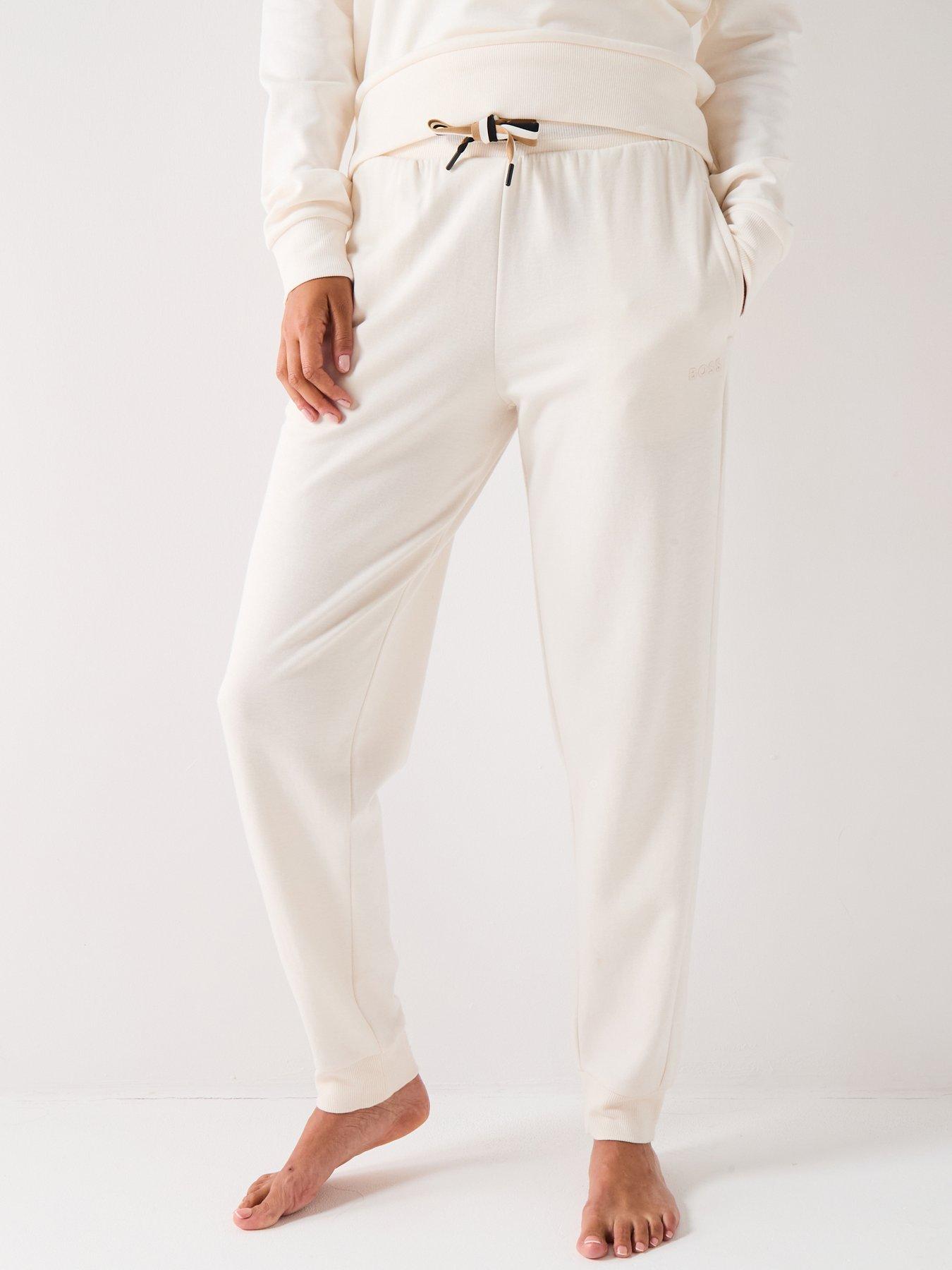 Image 1 of 4 of BOSS Cuffed Tracksuit Bottoms With Signature Stripe Drawcord - Cream