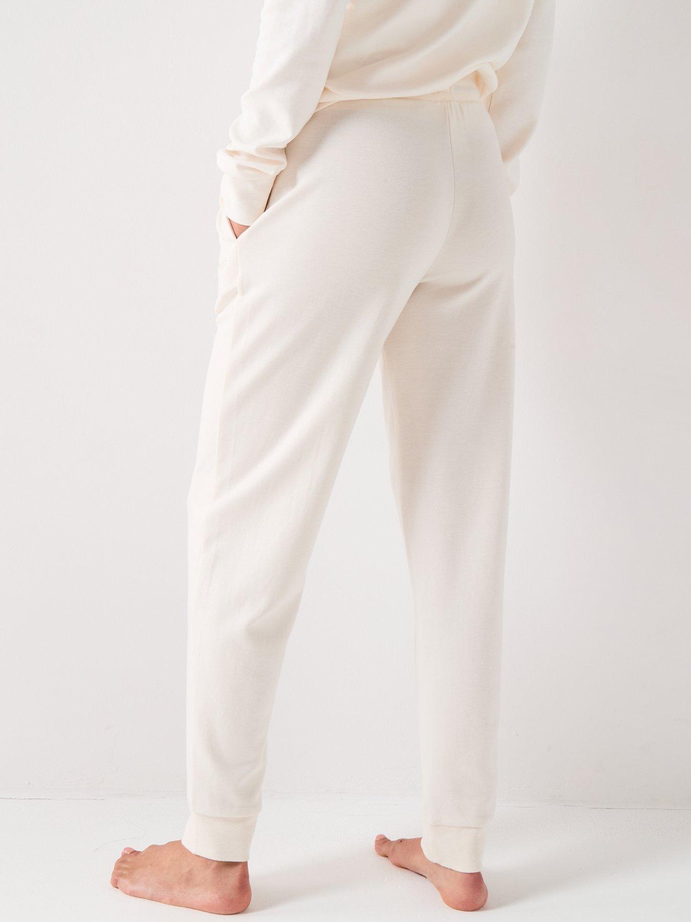 Image 2 of 4 of BOSS Cuffed Tracksuit Bottoms With Signature Stripe Drawcord - Cream