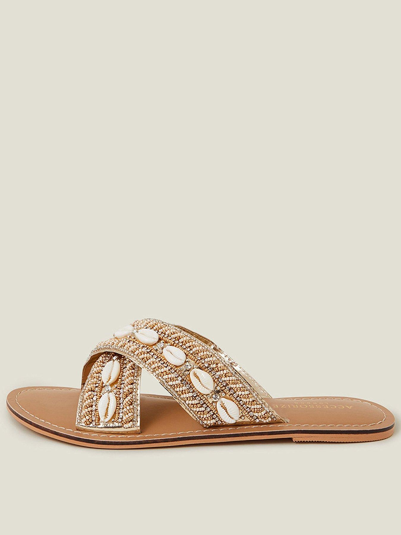 Image 1 of 4 of Accessorize Shell Cross Strap Sandals - Gold