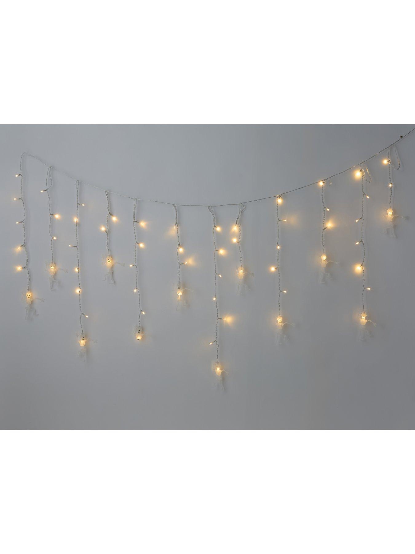 very-home-skeleton-and-santa-window-curtain-lightback