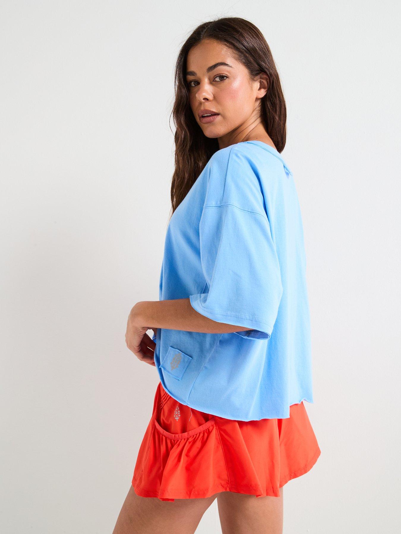 fp-movement-womens-training-inspire-tee-logo-iss-bluestillFront