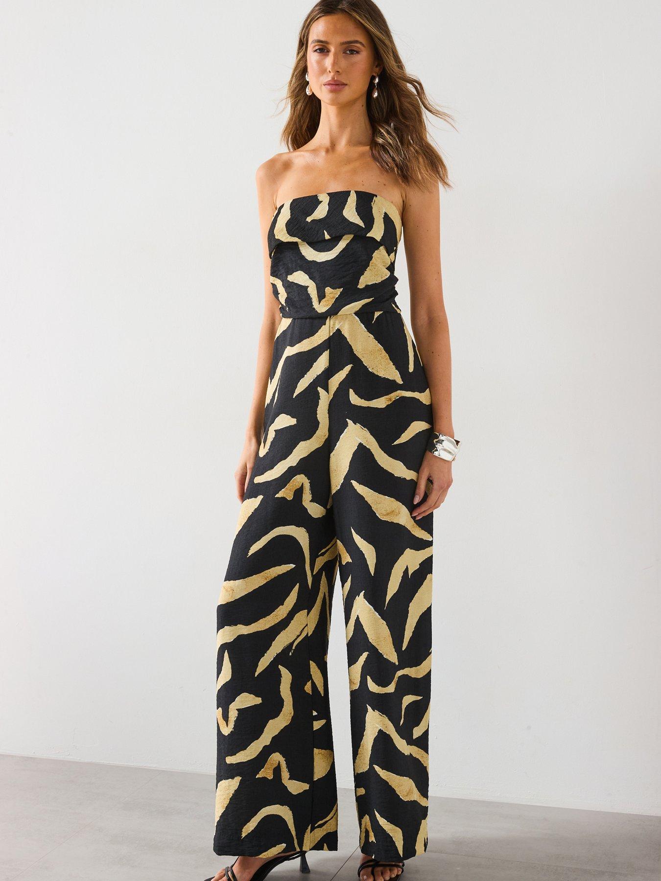 Image 1 of 6 of Mango Printed Strapless Jumpsuit - Black