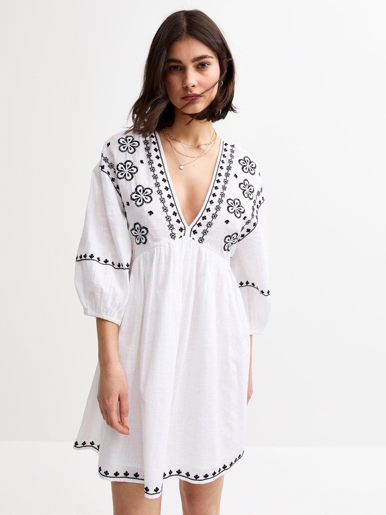 Image 1 of 4 of New Look Floral Embroidered Smock Mini Dress - White